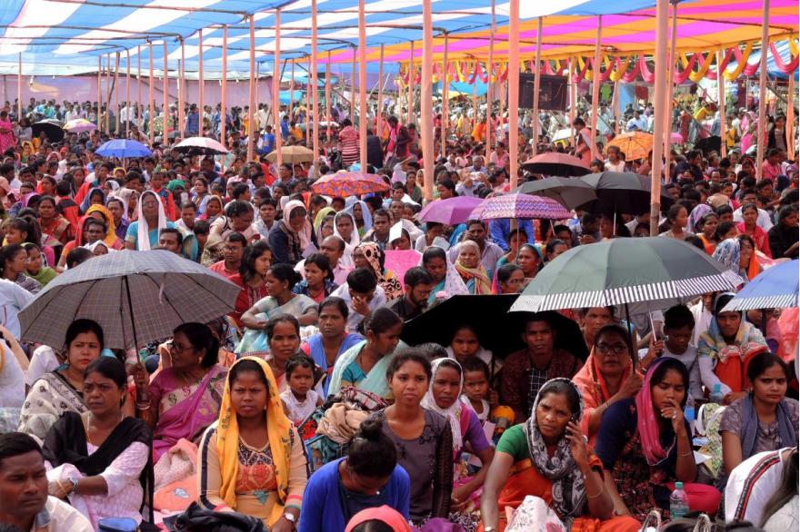 Devotees are seated under tents for the Mass for Dhori Mata.
